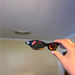 Sporty Black Sunglasses with Amber Mirrored Lenses Oakley Oakleys